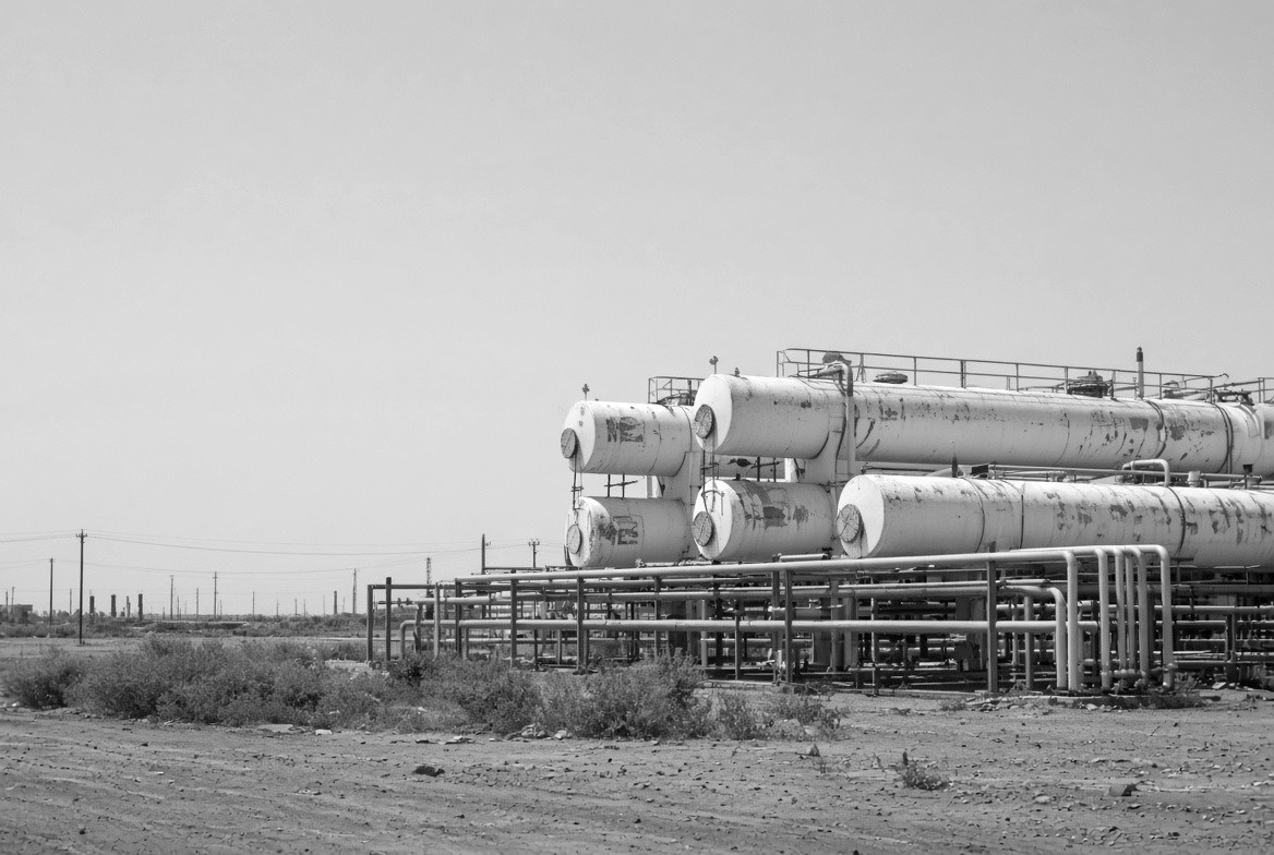 Rows of horizontal pressure vessels connected by pipework at an industrial site.